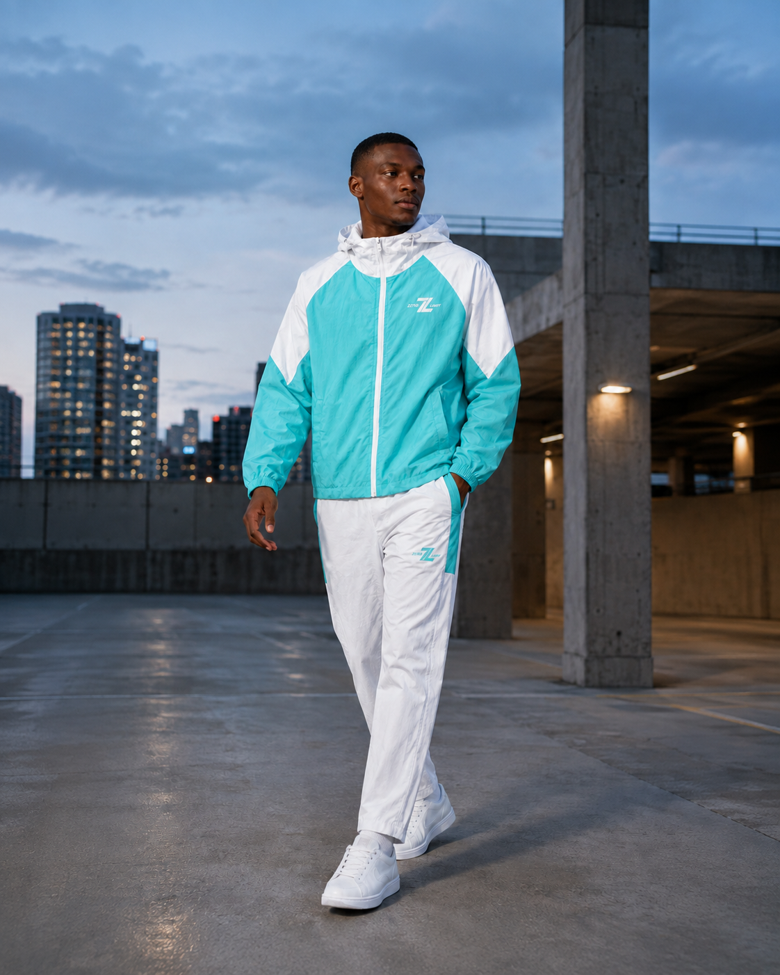 Model wearing ZERO LIMIT Technical Tracksuit Set in Tiffany Blue and White